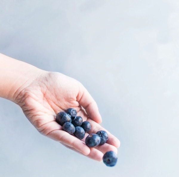 woman holding berries