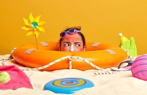 woman with sun cream on her nose 