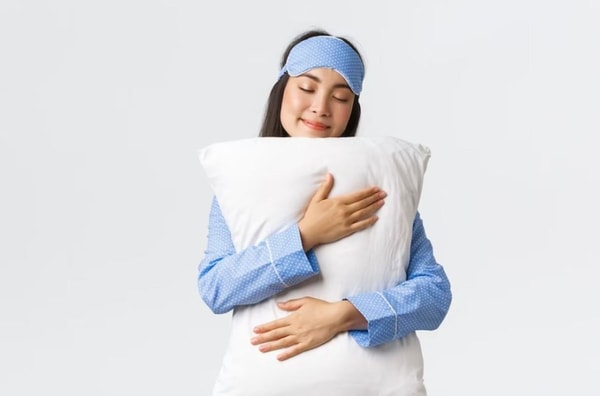 woman hugging pillow