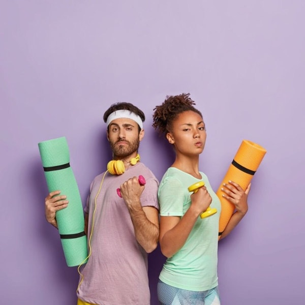 woman and man posing with sport equipment