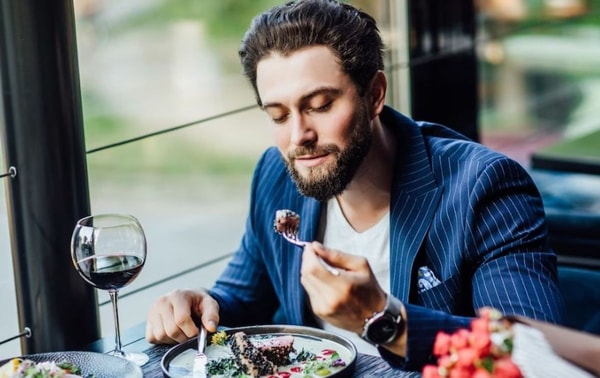 man eating meat
