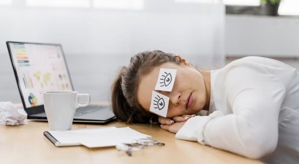 woman sleeping at work