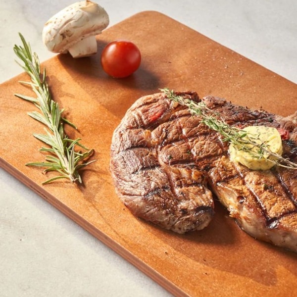 steak with butter on top 