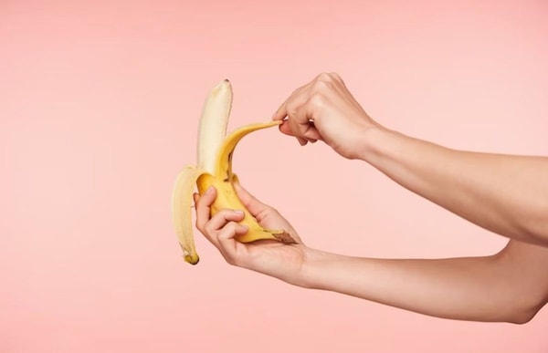human peeling banana