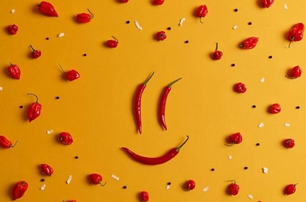 funny persons face smile made of red hot chili pepper